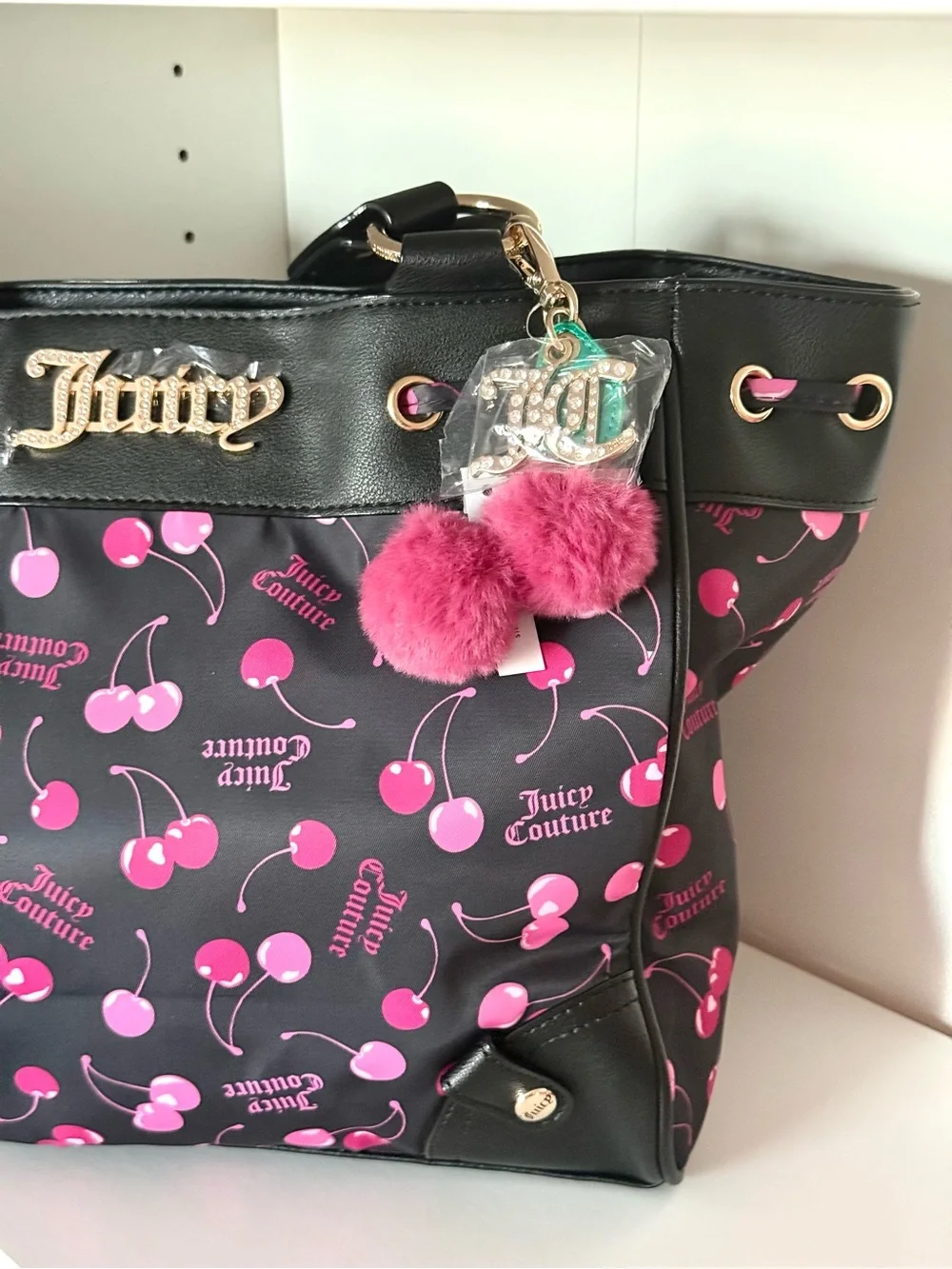Juicy Couture “Sweet Cherry” Black Tote with Pink Cherry Print and Pom-Pom Charm
